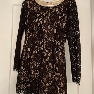 Romper with black lace and nude underlay size Medium with lace edges